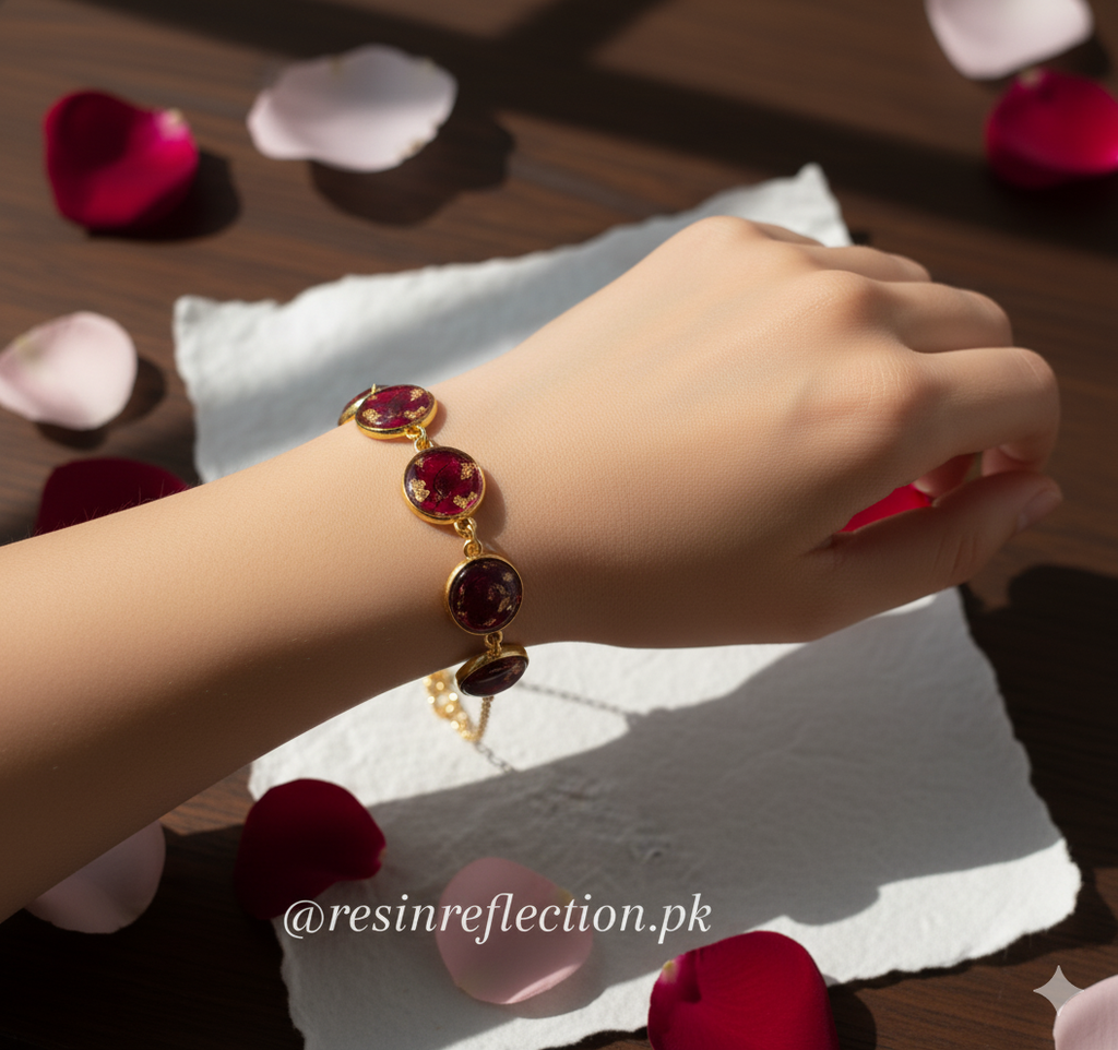 Gold bracelet with red gemstones on a hand, surrounded by rose petals, real flowers bracelet, rose preserved bracelet, real flowers jewelry 
